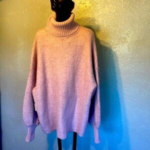 Free people lavender pullover sweater says small, but it is very large